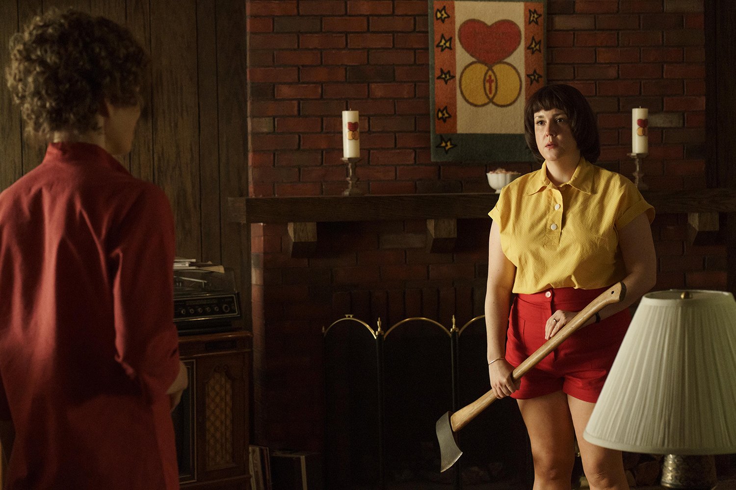 Jessica Biel as Candy Montgomery and Melanie Lynskey as Betty Gore, who holds an axe for the fight scene in 'Candy' Episode 5.