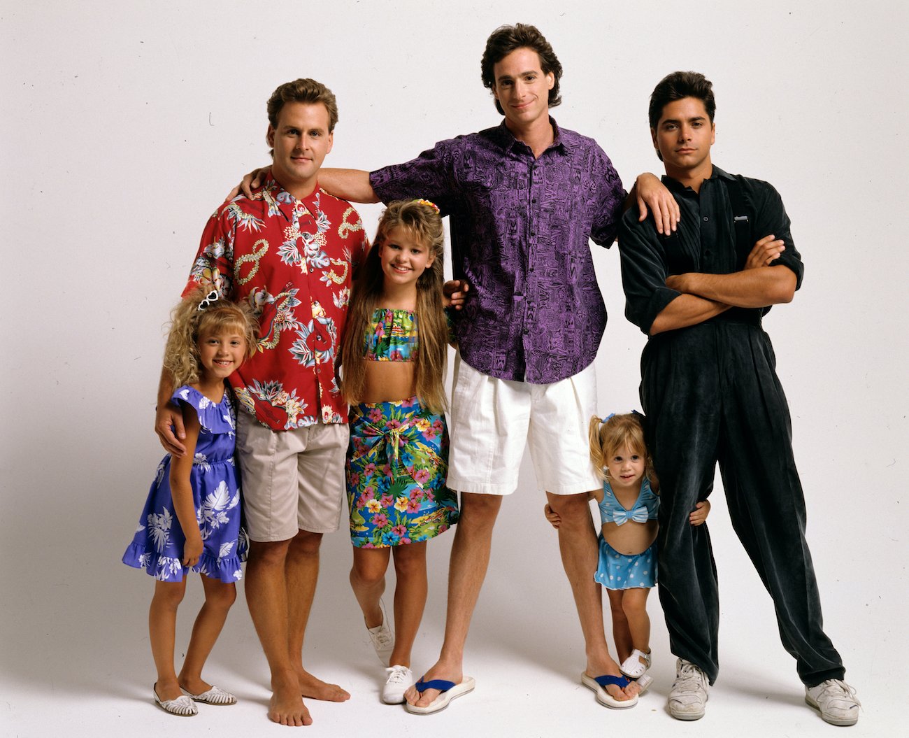 The cast of 'Full House' including Stephanie (Jodie Sweetin), Joey (Dave Coulier), D.J. (Candace Cameron), Danny (Bob Saget), Michelle (Mary Kate/Ashley Olsen) and Jesse (John Stamos)