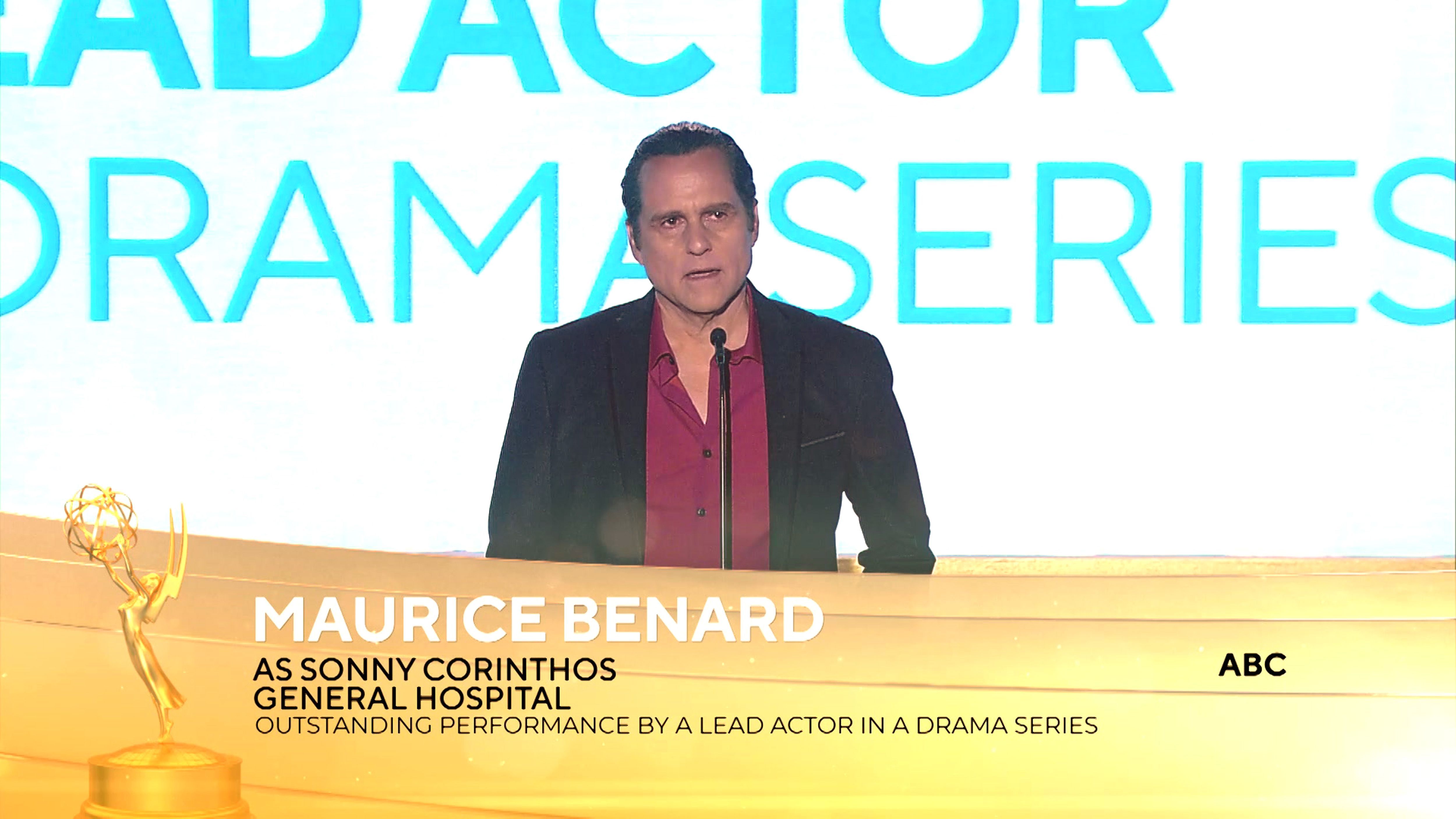 'General Hospital' actor Maurice Benard wearing a burgundy shirt and black suit onstage at the 2021 Daytime Emmy Awards.