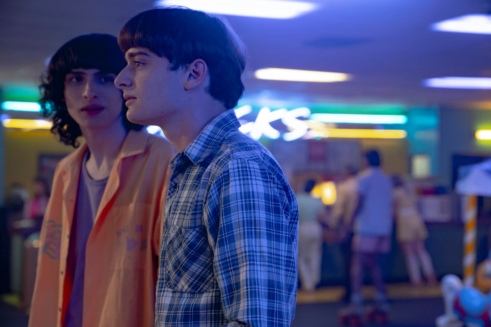 Will (Noah Schnapp), who many fans think is gay, looks annoyed as Mike (Finn Wolfhard) looks at him quizzically in 'Stranger Things' Season 4