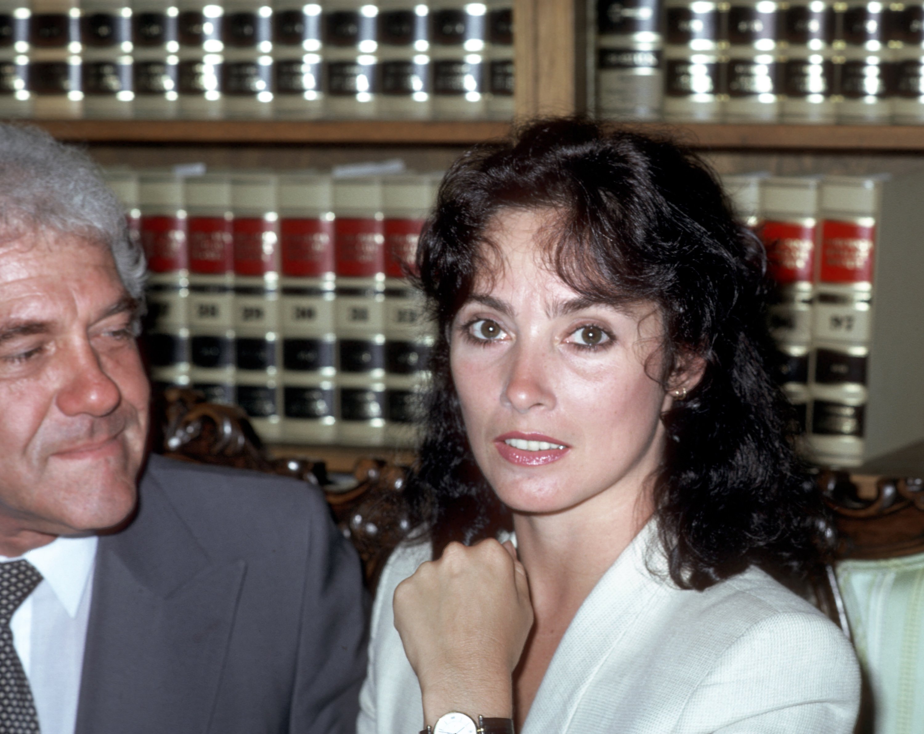 Marvin Mitchelson and Nancy Lee Andrew in front of a bookshelf