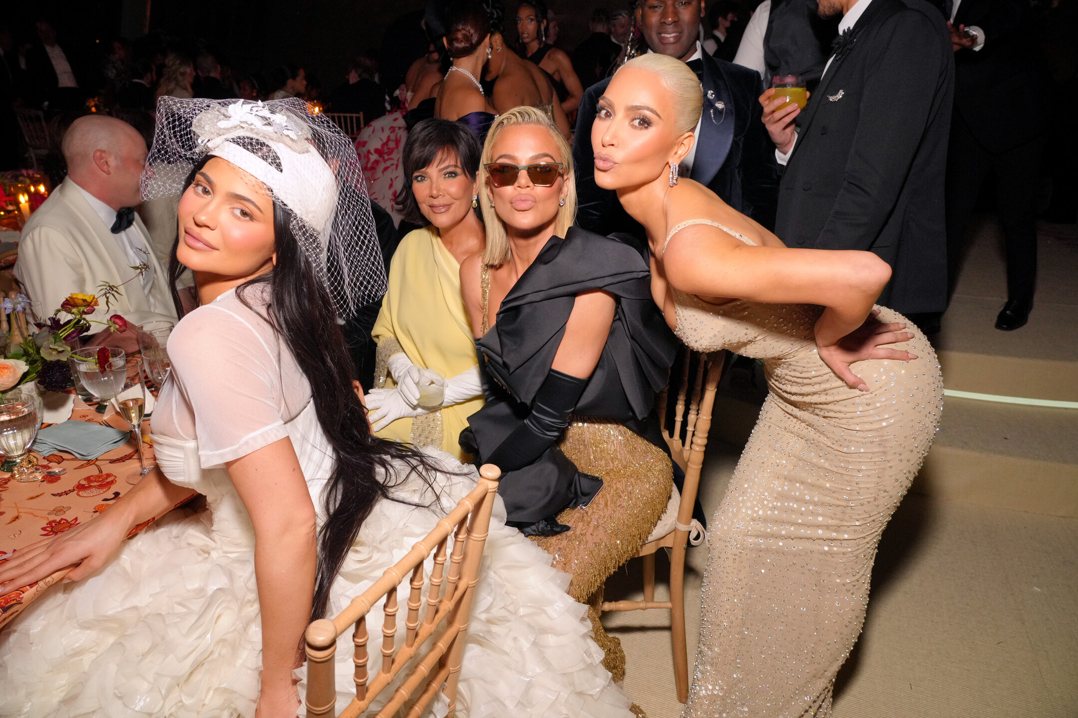 Khloé Kardashian did not want to attend the Met Gala. Sister Kim convinced her. Here's the family photographed together sitting down at the event.