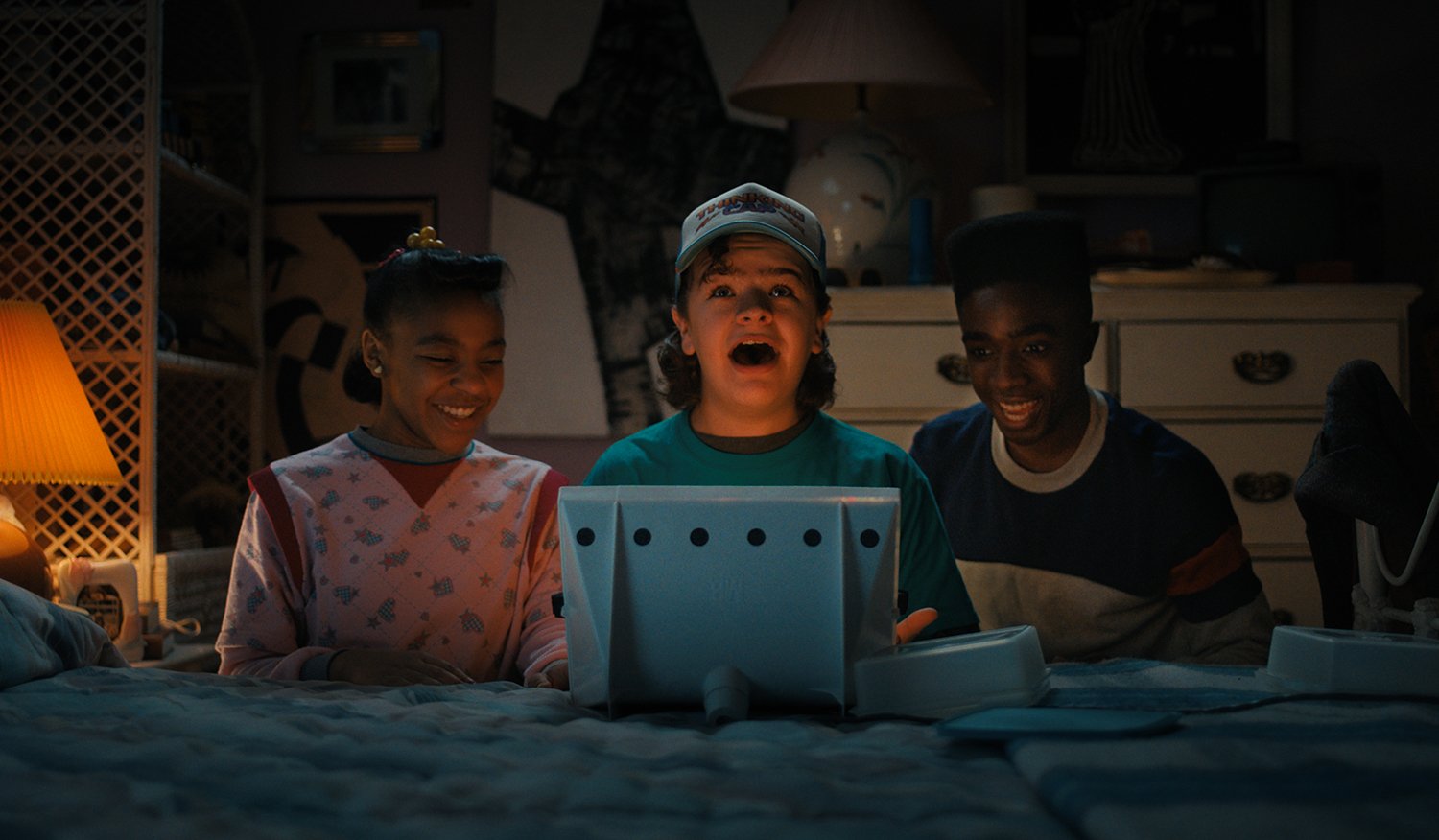Priah Ferguson as Erica Sinclair, Gaten Matarazzo as Dustin Henderson and Caleb McLaughlin as Lucas Sinclair in Stranger Things 4, which may be too scary for kids.