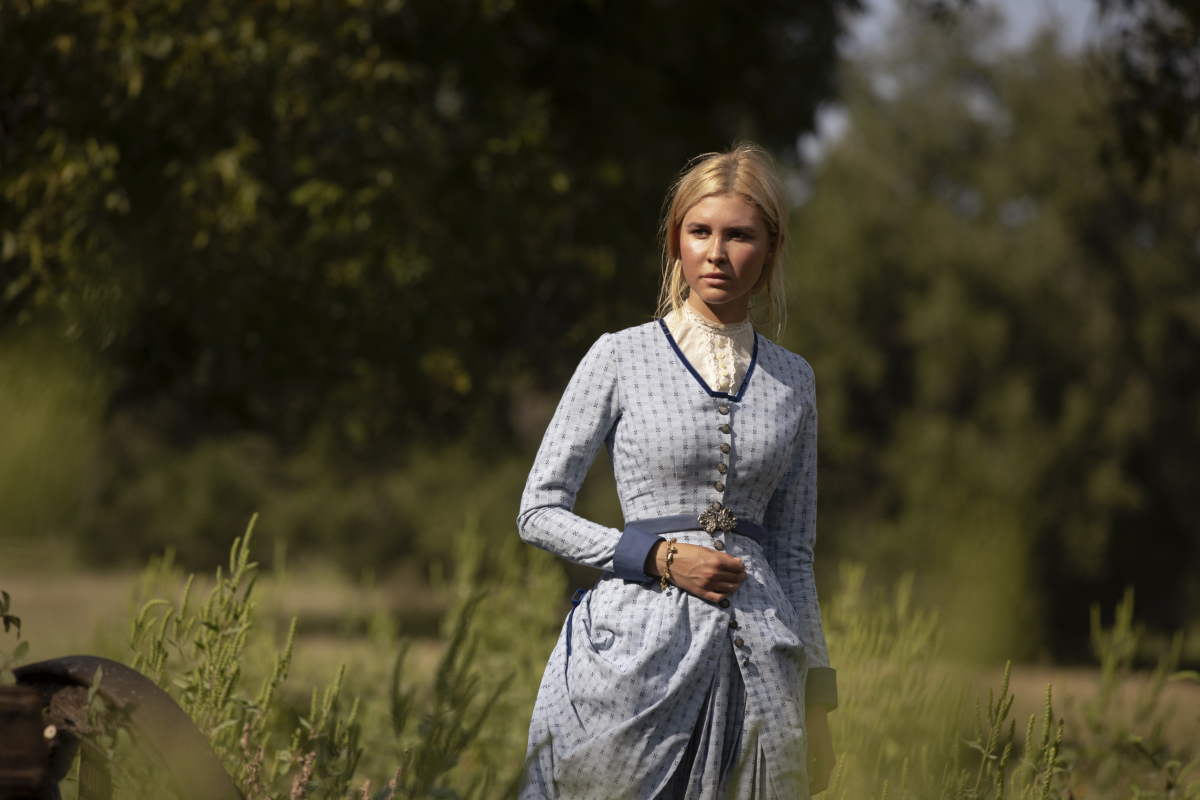 '1883': Isabel May stands in the grass, but as a kid her isolation led to her career
