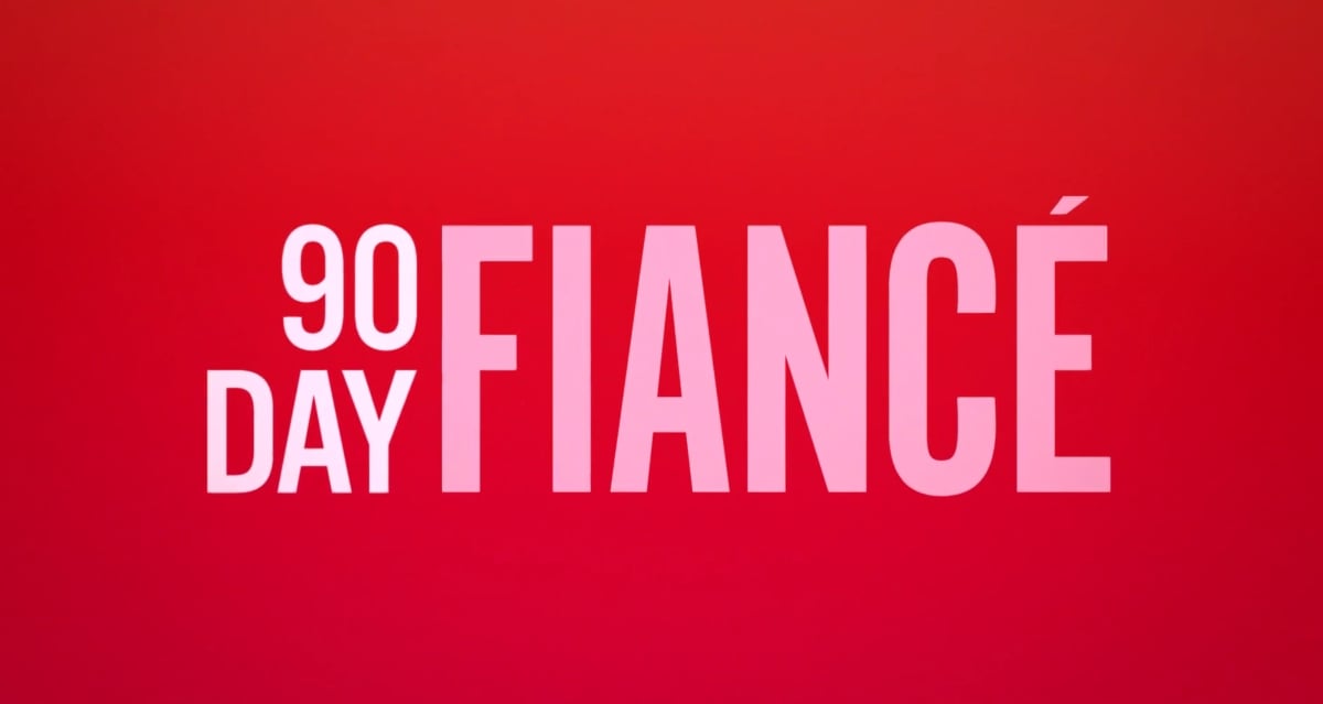 '90 Day Fiancé' title screen written in white and pink letters in front of a red background.