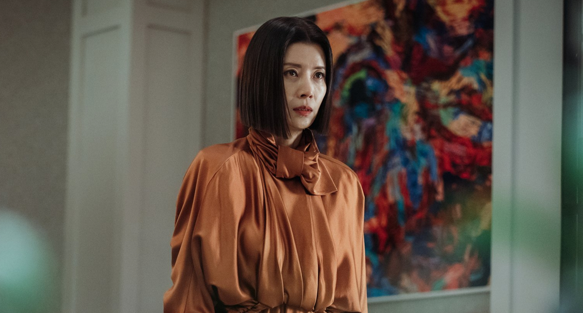 Actor Yoo-sun as So-ra in 'Eve' Episode 6 wearing an orange dress.