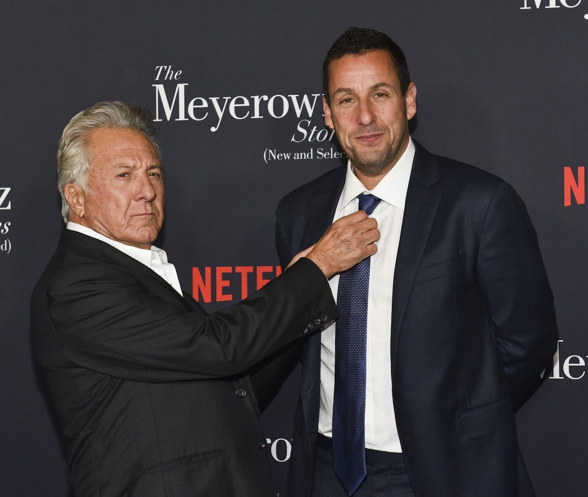 Dustin Hoffman grabs Adam Sandler's tie during the screening of Netflix's "The Meyerowitz Stories