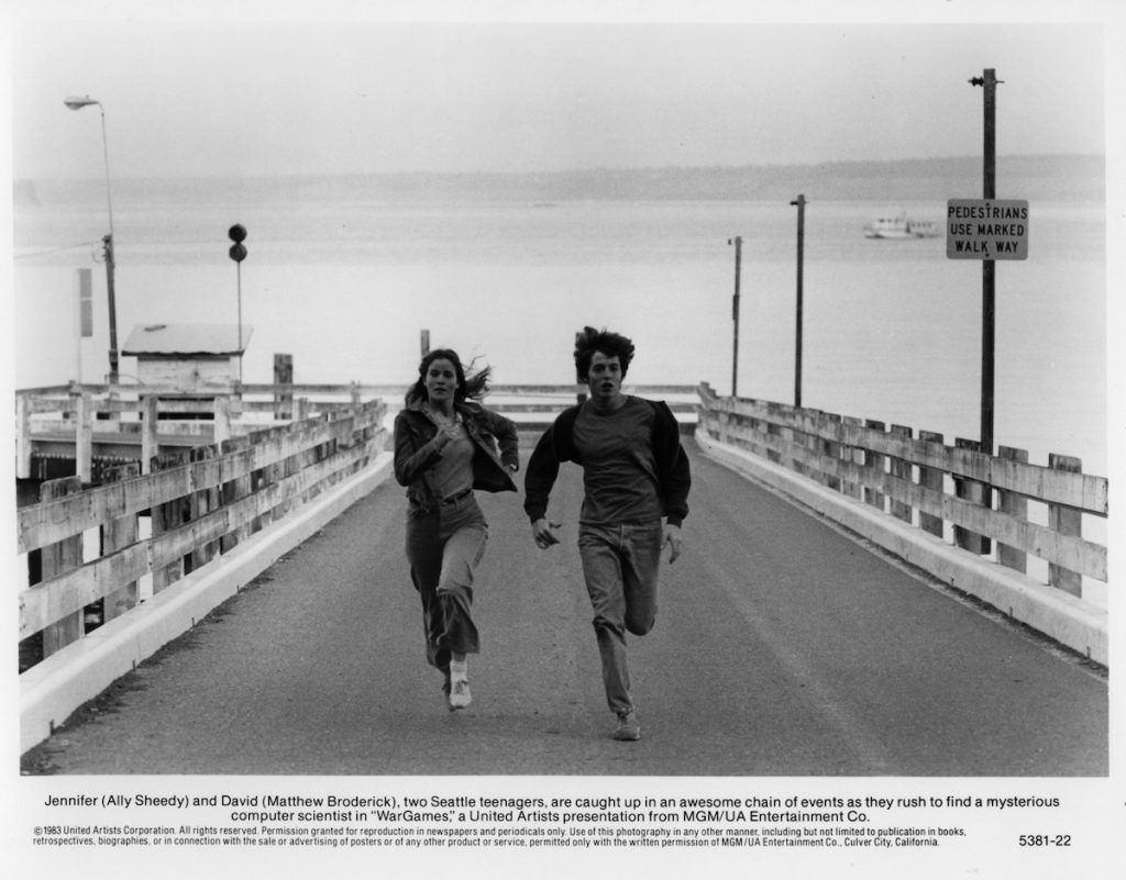 Ally Sheedy and Matthew Broderick run in a scene from WarGames 1983