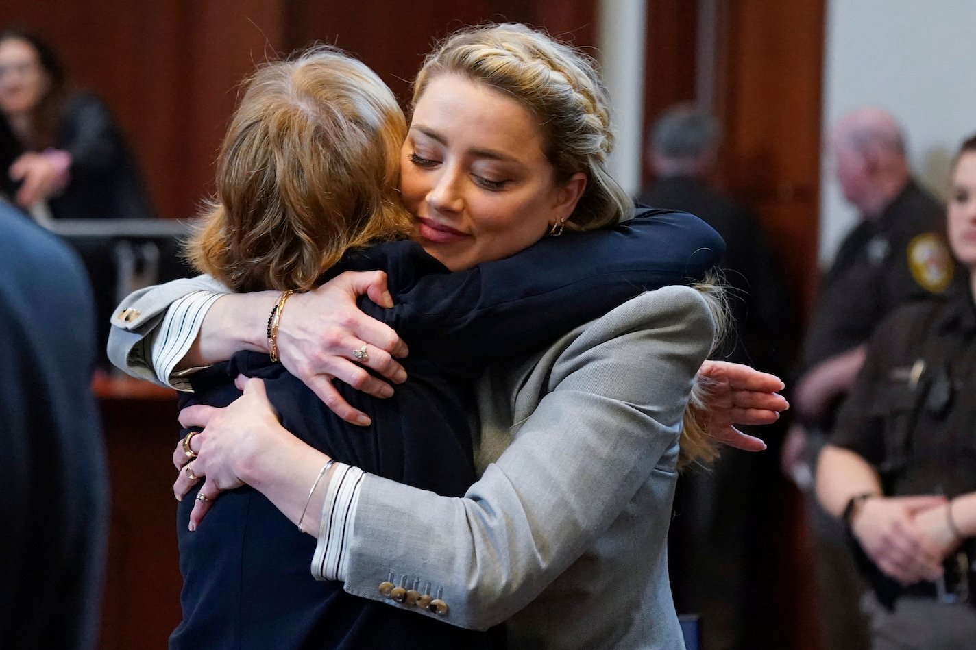 Amber Heard hugs her attorney Elaine Bredehoft after closing arguments