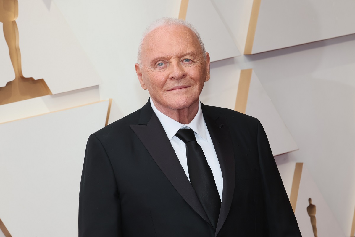 Anthony Hopkins smirking while wearing a suit.