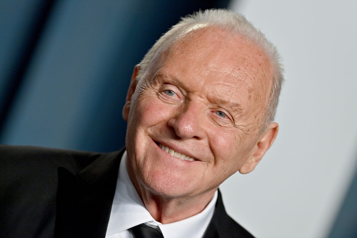 Anthony Hopkins smiling while wearing a suit.