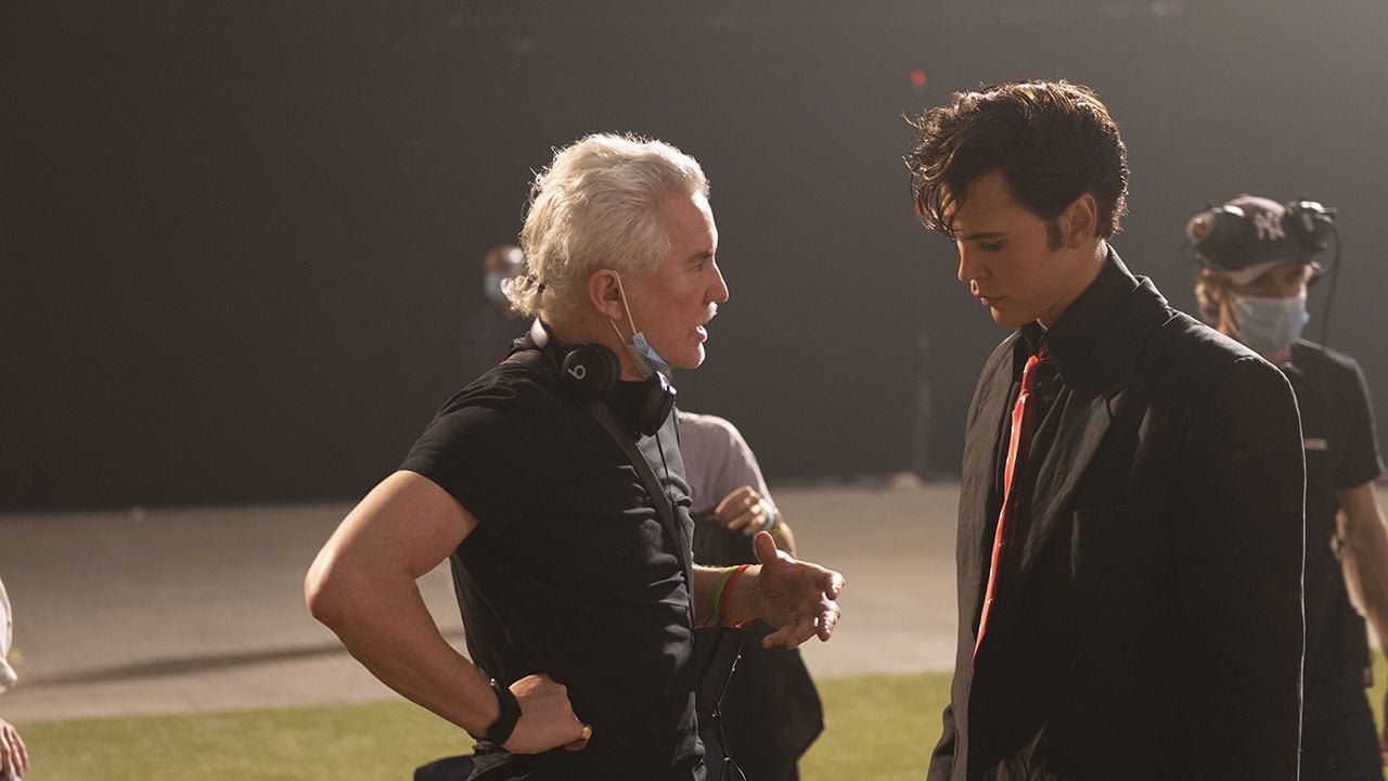 Baz Luhrmann (left) directs Austin Butler in 'Elvis.' Butler said working with Luhrmann was like "playing jazz" because of script rewrites that required improvisation.