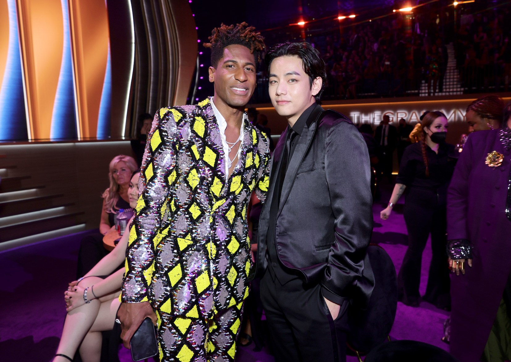 Jon Batiste and V of BTS attend the 64th Annual GRAMMY Awards