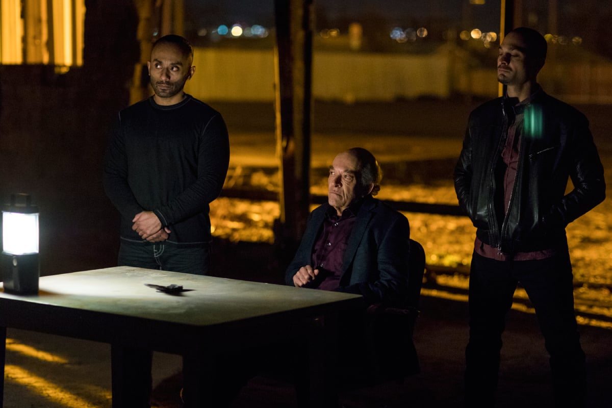 Mark Margolis as Hector Salamanca, Michael Mando as Nacho and Vincent Fuentes as Arturo in Better Call Saul. Hector sits at a table and Nacho and Arturo stand behind him.