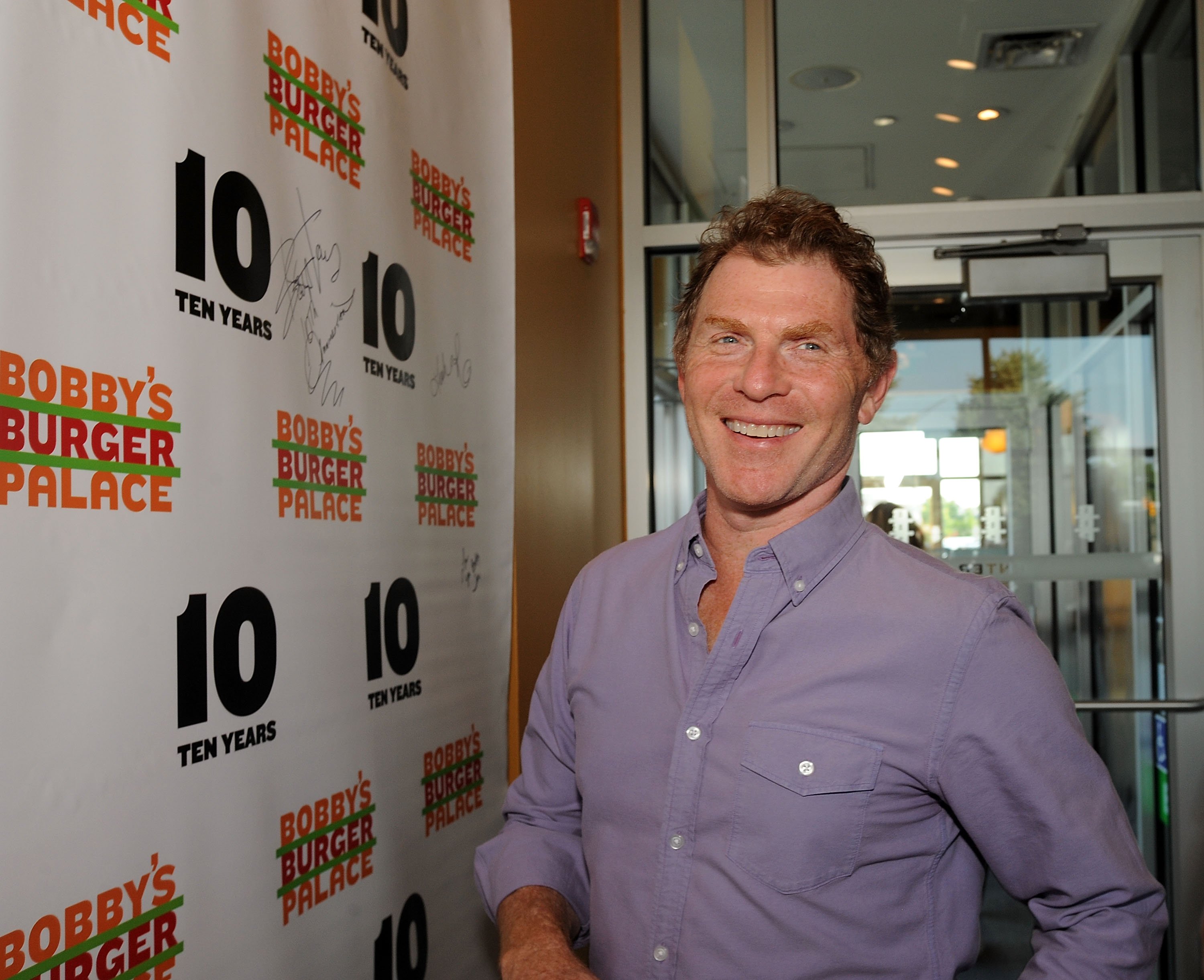 Food Network star Bobby Flay wears a button-down shirt in this photograph.