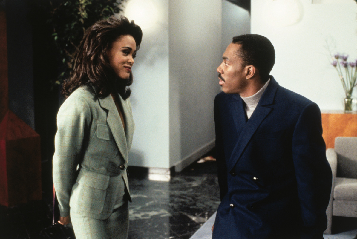 'Boomerang': Eddie Murphy sits on the arm of a sofa talking to Robin Given's, whose feet are a relief to him