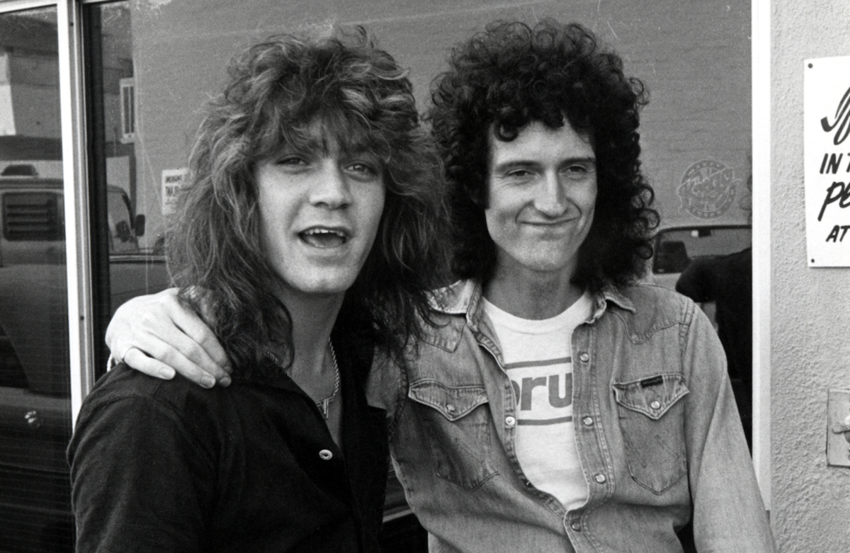 Brian May of Queen poses with Eddie Van Halen