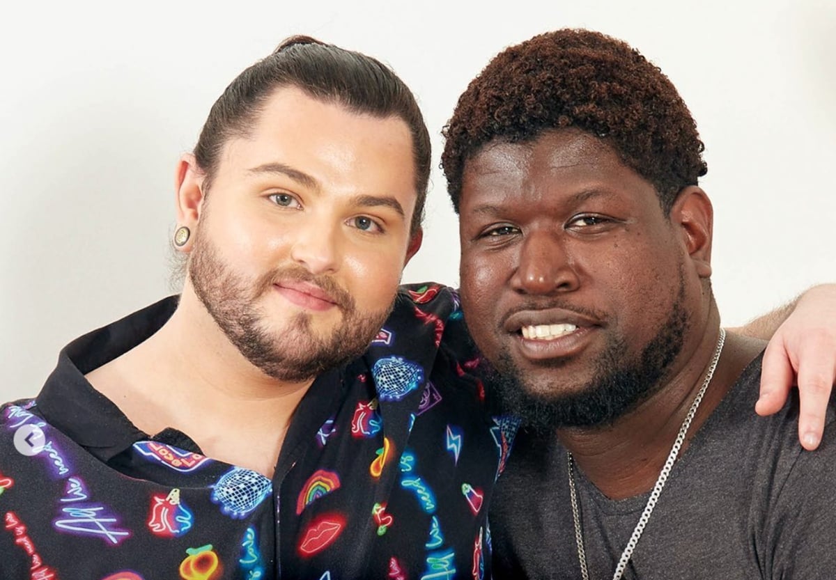 Calum stands behind fiancé, Marvin for promo photos for '90 Day Fiancé UK'.