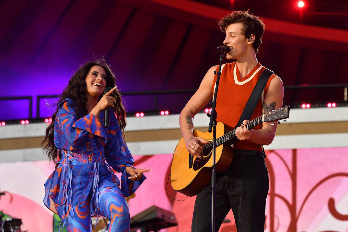 Camila Cabello and Shawn Mendes perform together on stage.
