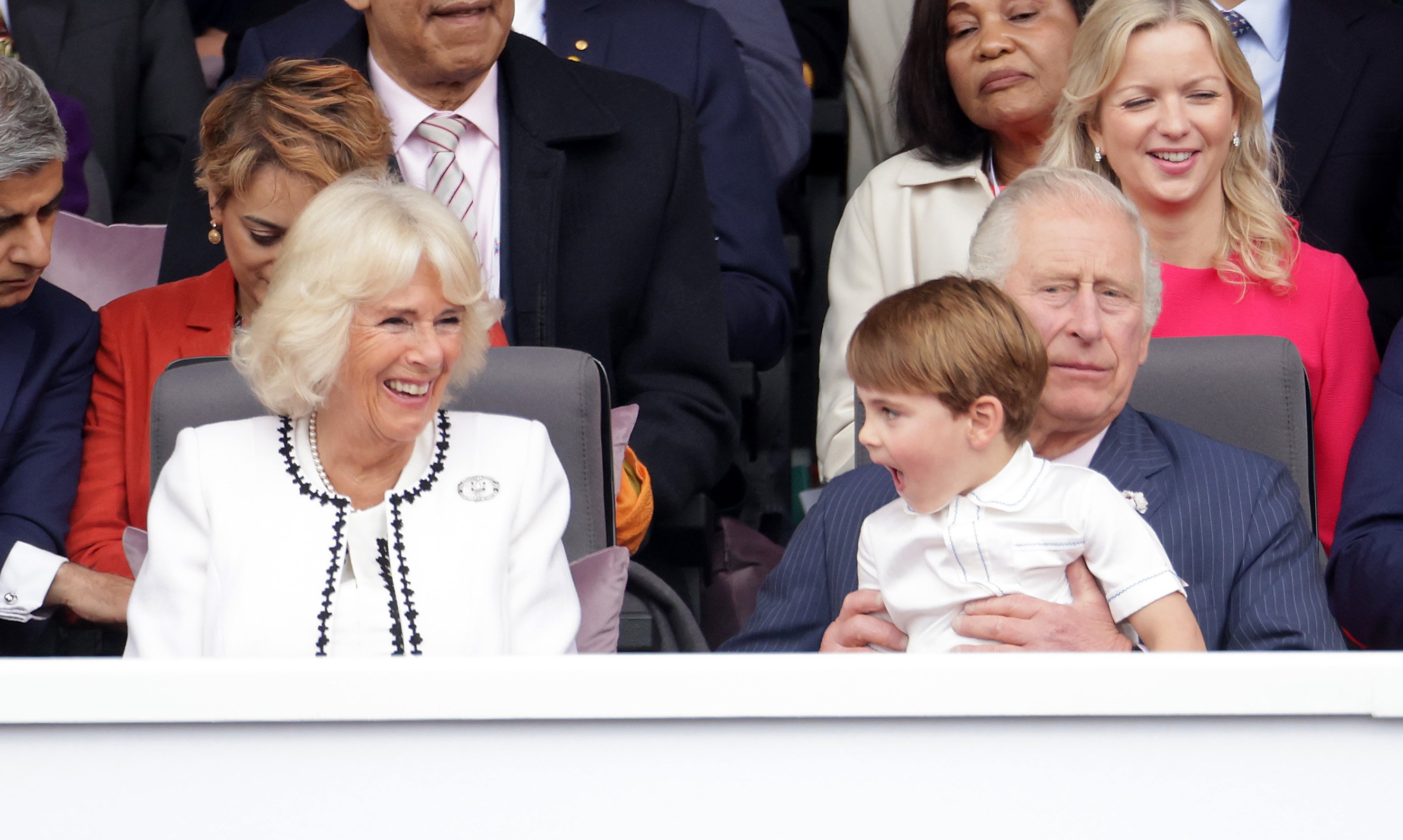 Camilla Parker Bowles, Prince Charles, and Prince Louis on his grandpa's knee at the Platinum Jubilee Pageant