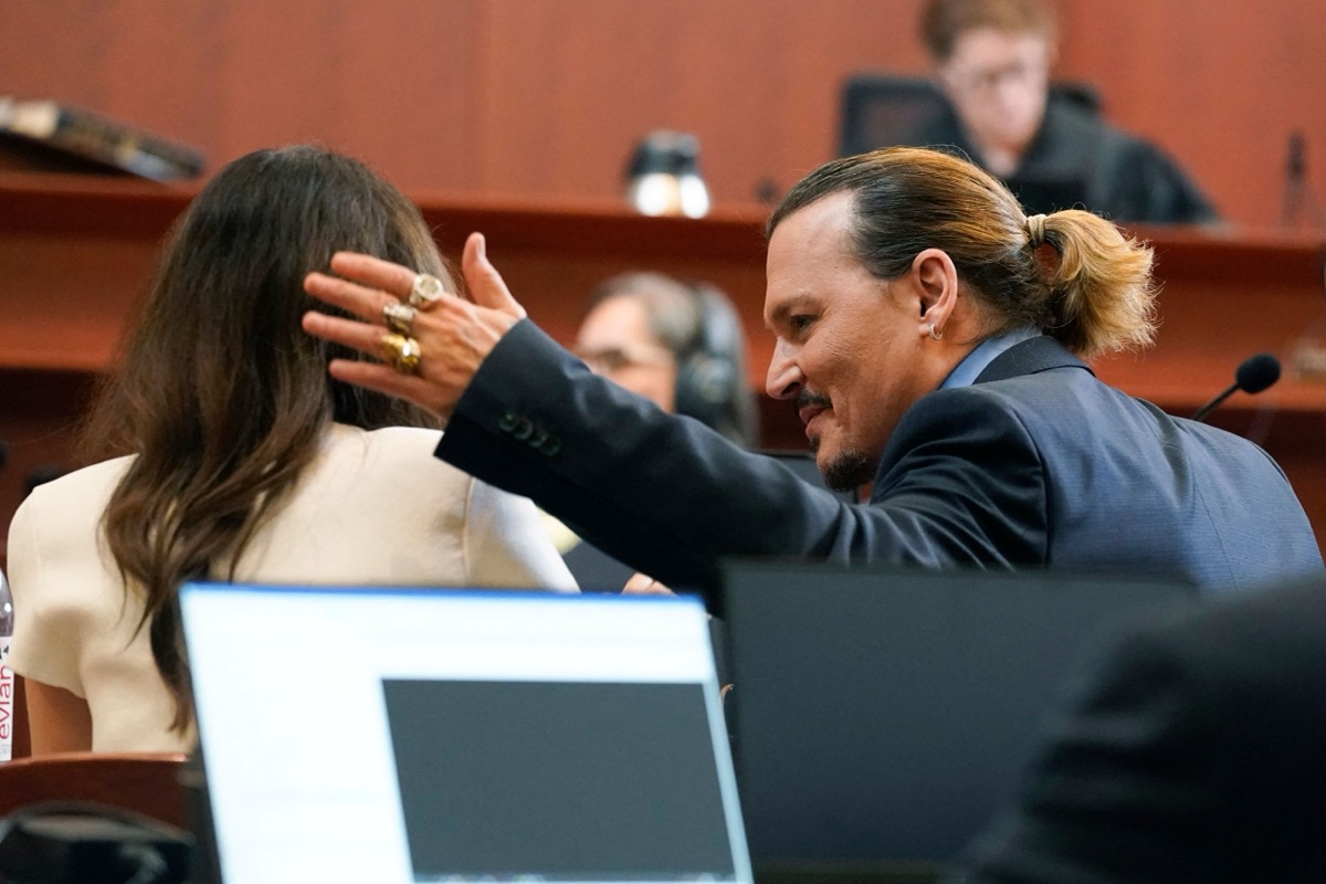 Johnny Depp talks with his attorney Camille Vasquez during his trial