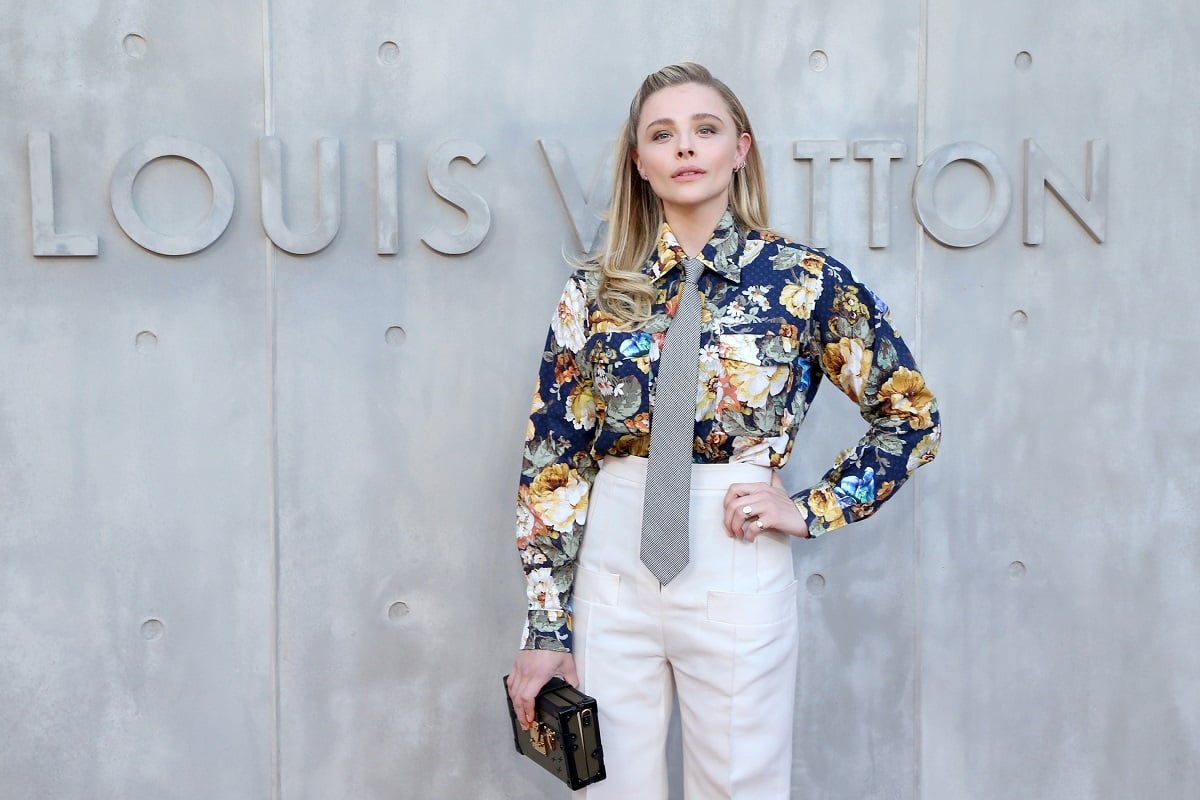 Chloe Grace Moretz posing while wearing a suit.