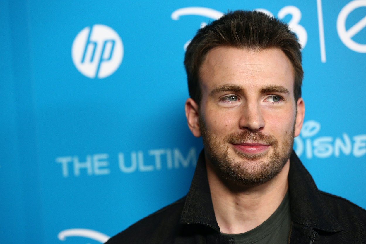 Chris Evans at a 2013 Disney even in California. Evans nominated Adam Driver to play him in a biopic movie, though he might have been distracted by puppies frolicking around him.