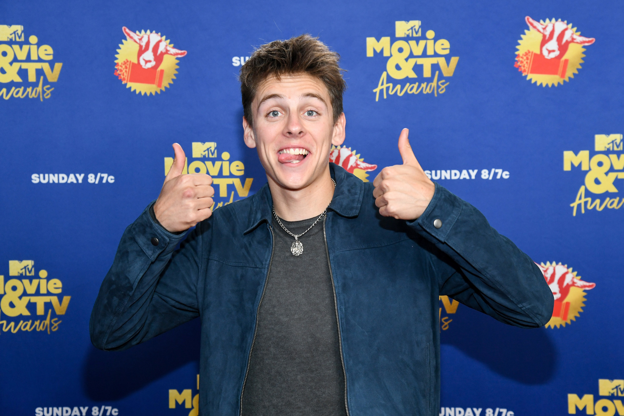 'Cobra Kai' star Jacob Bertrand gives thumbs up for the fans and sticks his tongue out at the MTV Movie & TV Awards