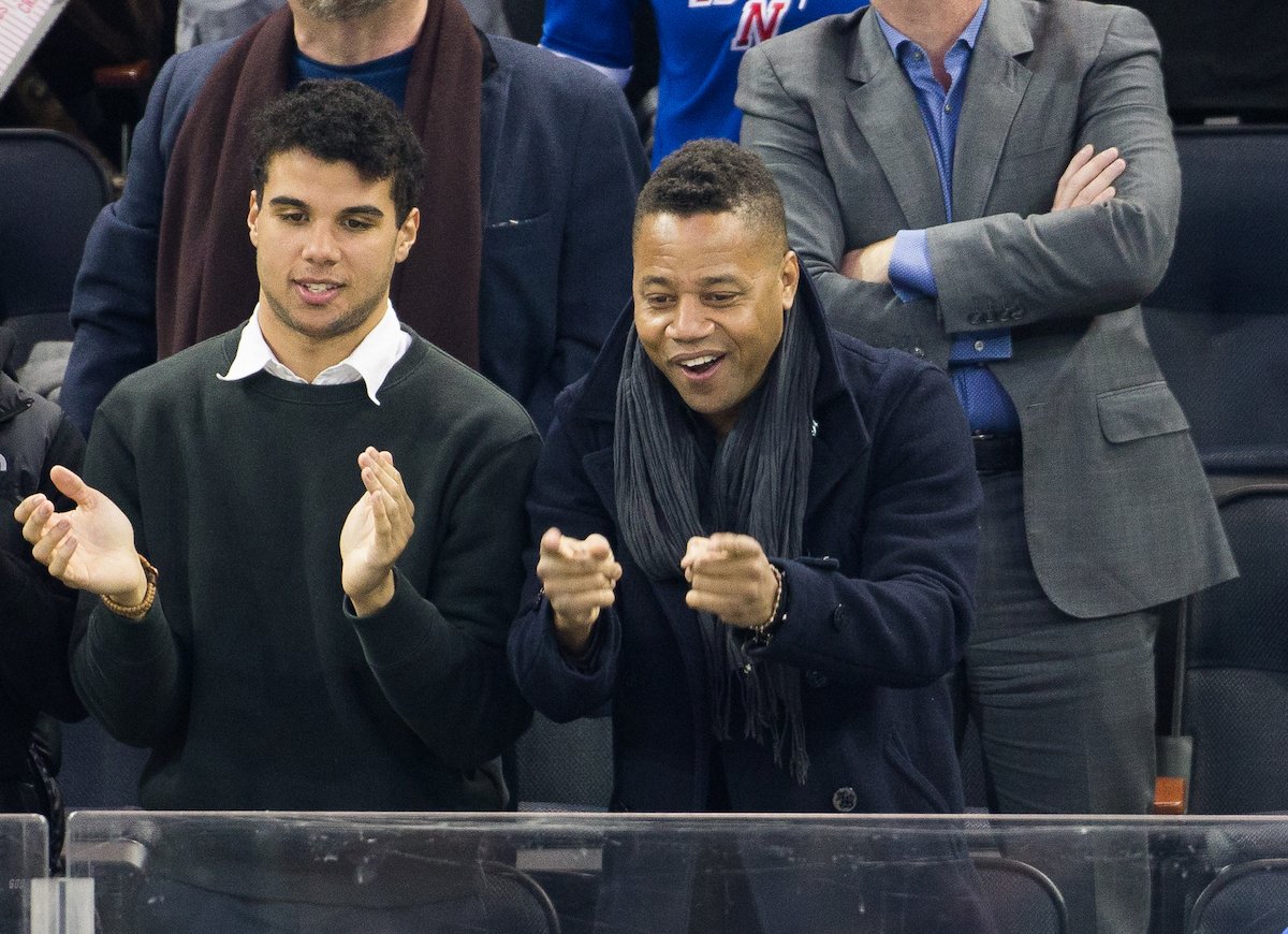 Actor Cuba Gooding Jr. and his son, Mason Gooding clap during an event at Madison Square Garden in 2016