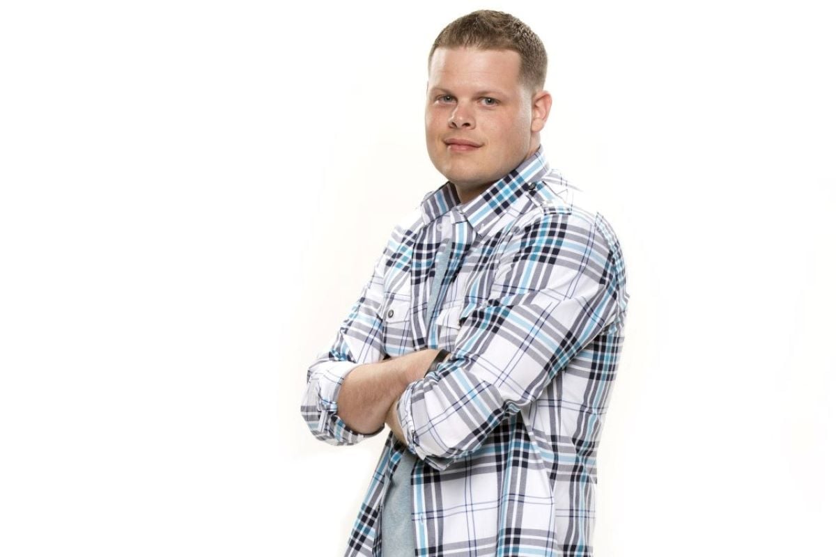 Derrick Levasseur, who won 'Big Brother' Season 16, wears a blue, gray, and white plaid shirt.