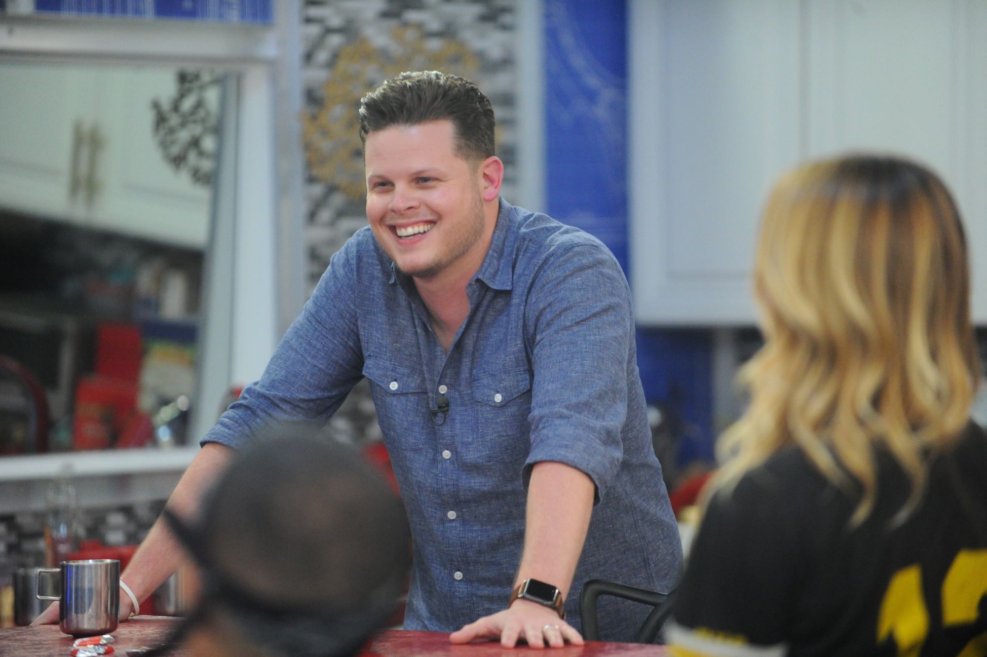 Derrick Levasseur, who won 'Big Brother' Season 16, wears a blue button-up shirt.