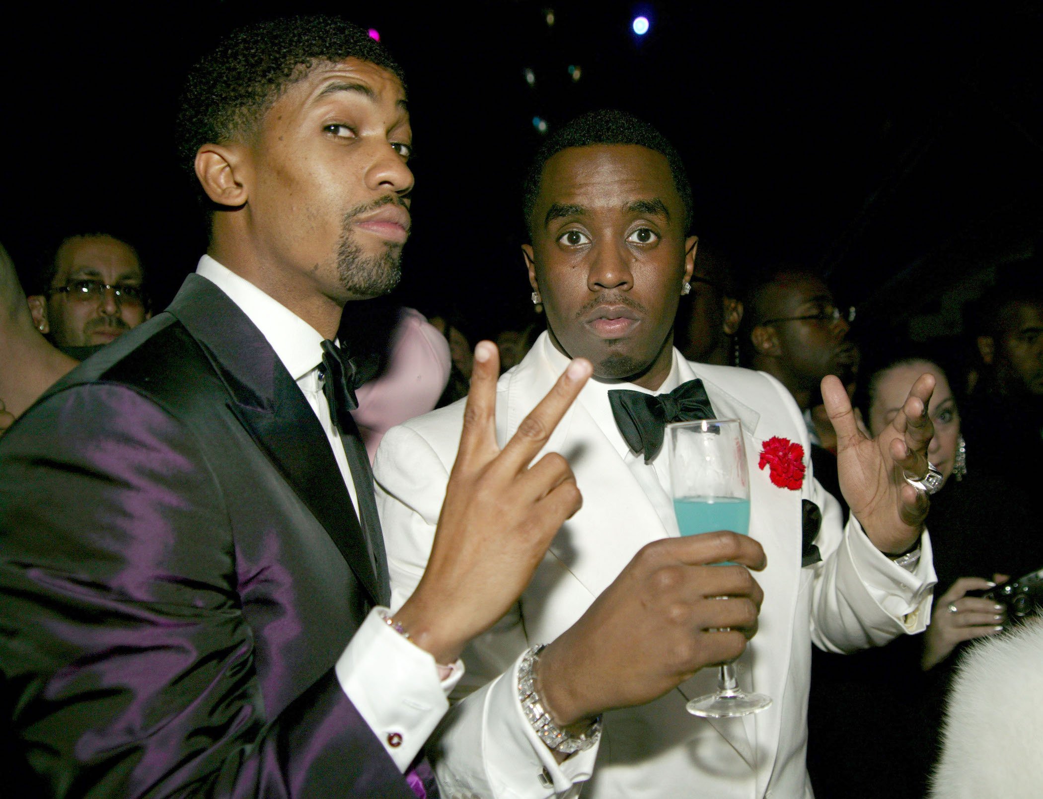 Derek Watkins aka Fonzworth Bentley and Diddy posing at a formal event