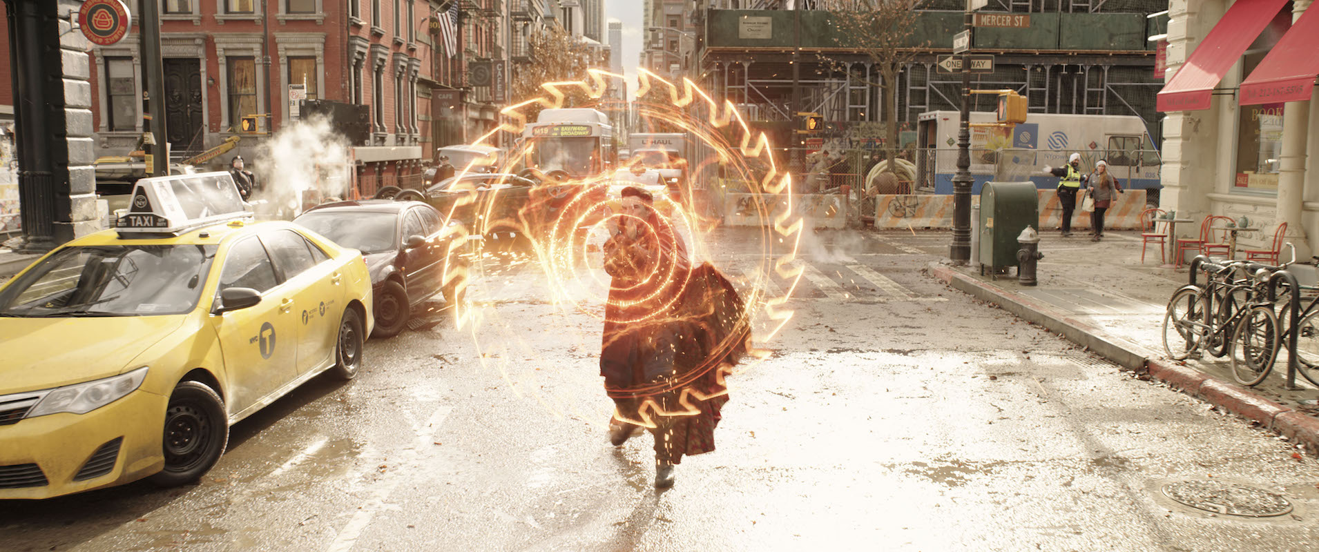 Doctor Strange (Benedict Cumberbatch) conjures a spell in the street before he meets the Illuminati