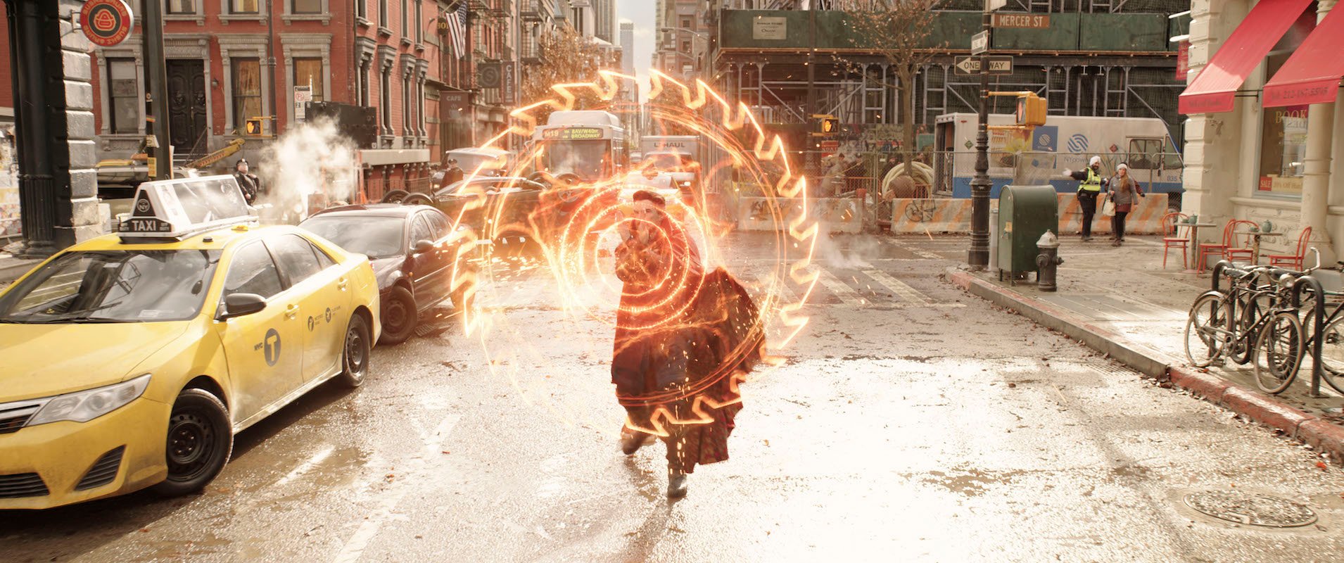 Doctor Strange (Benedict Cumberbatch) conjures a spell in the street before he meets the Illuminati