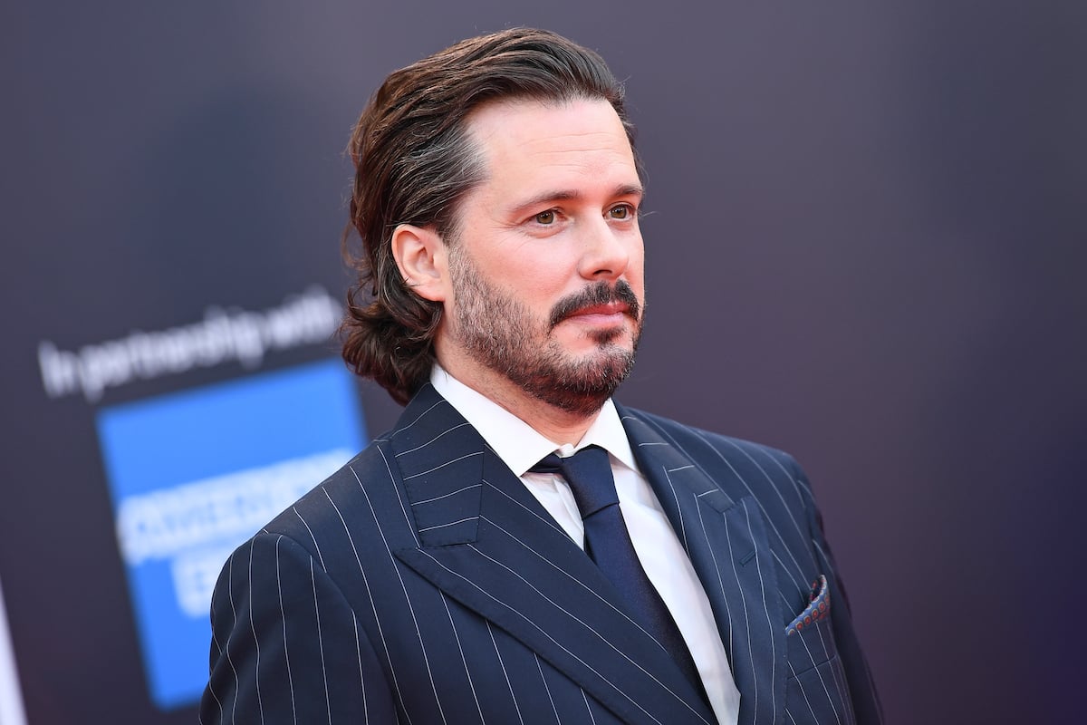 Edgar Wright in front of a dark blue background