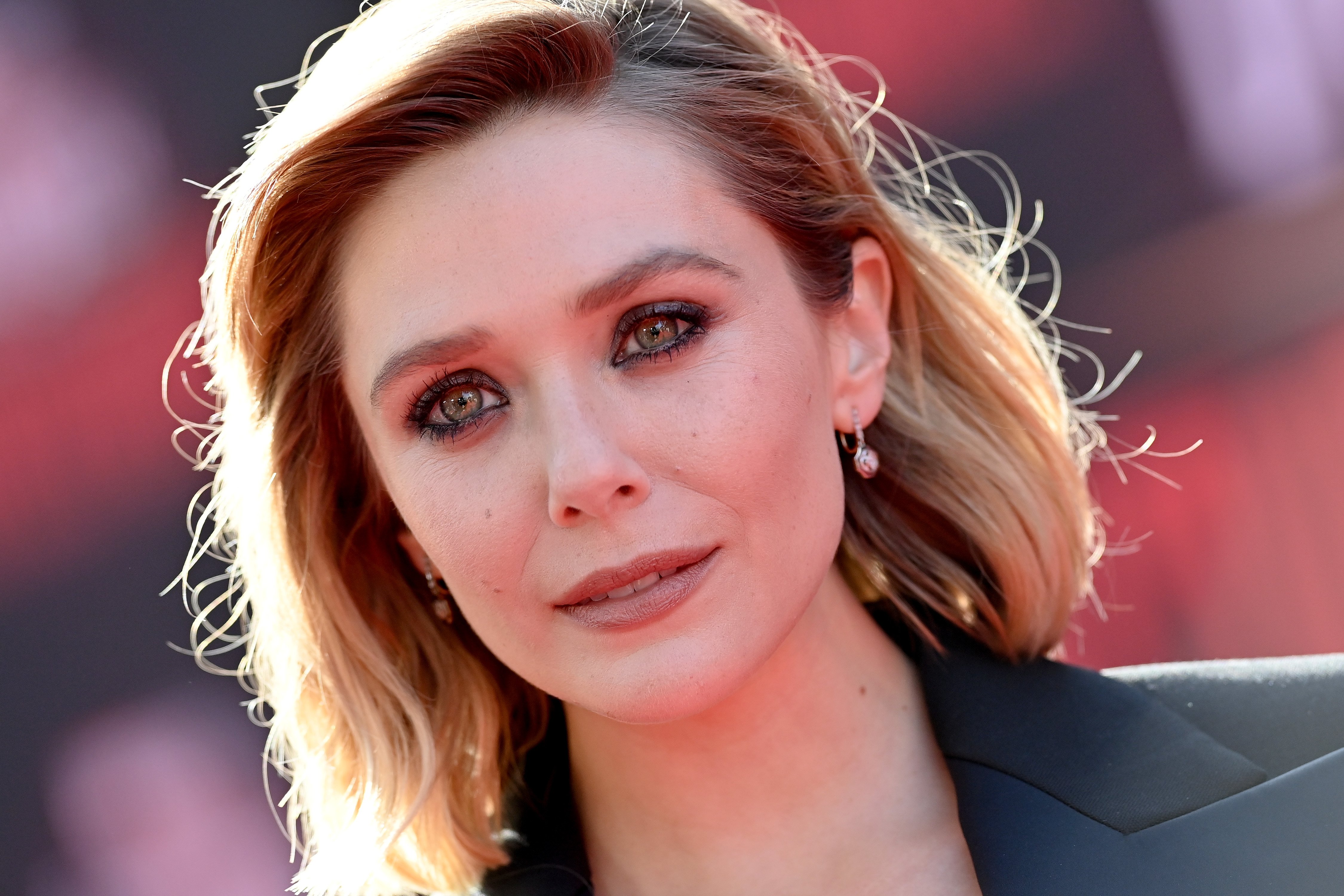 Elizabeth Olsen, who plays the Scarlet Witch in the MCU, wears a black suit.
