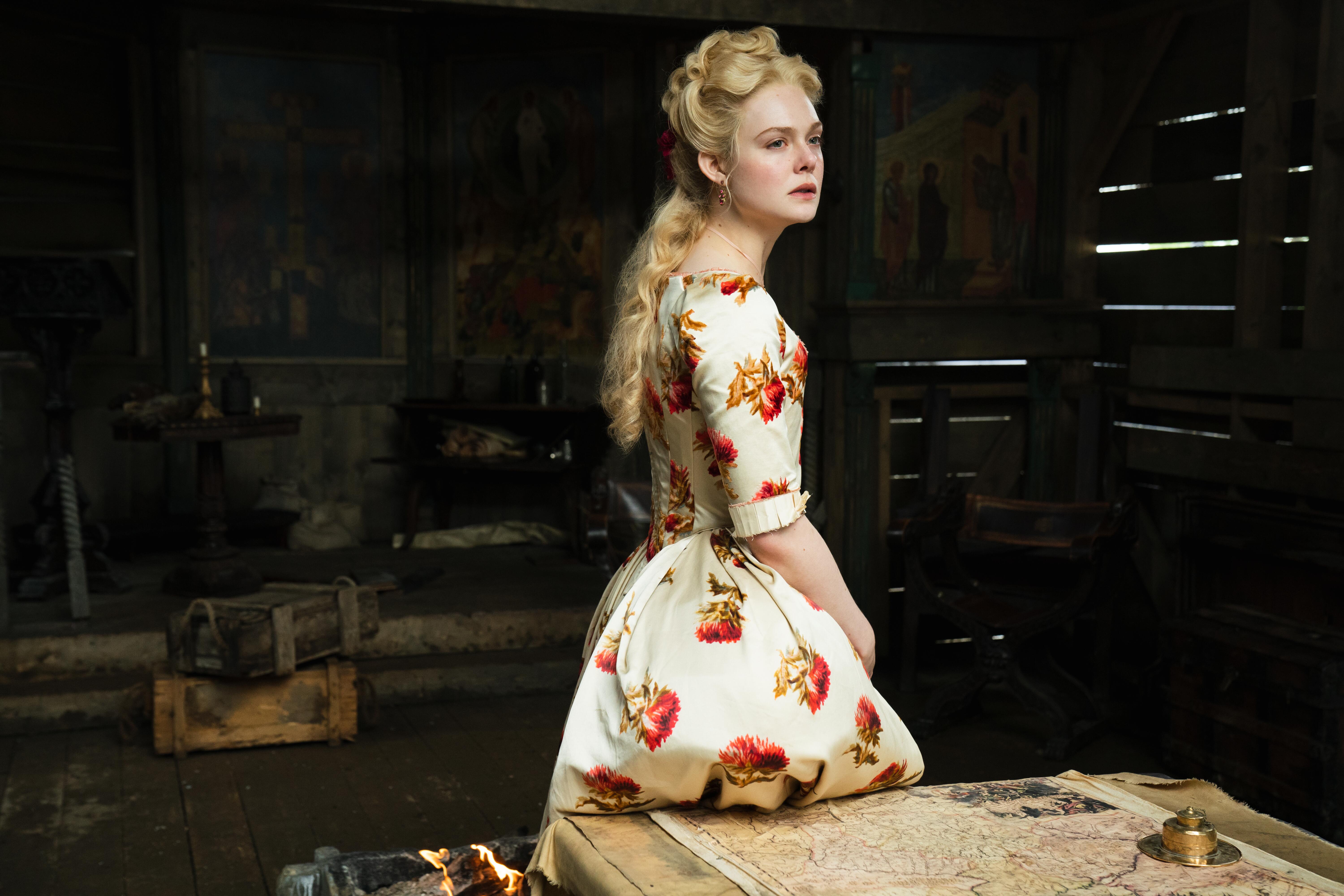 Elle Fanning as Catherine, wearing a floral-patterned dress in the Hulu series 'The Great'