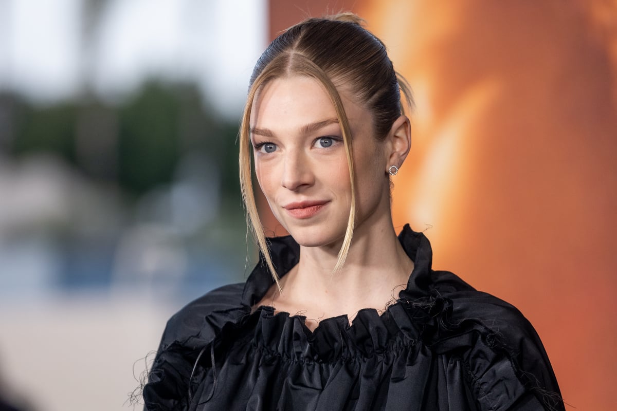 Hunter Schafer attends the HBO Max FYC event for Euphoria at Academy Museum of Motion Pictures. Schafer wears a black top and has her hair up. 