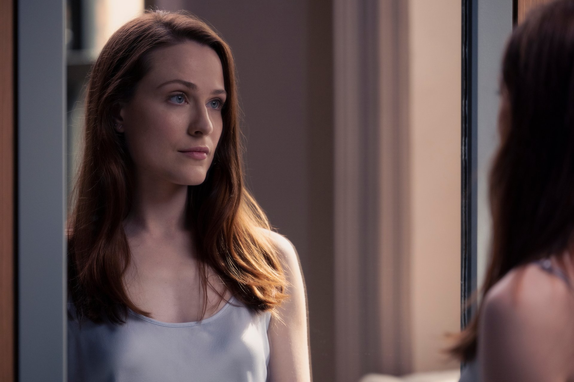 A close-up of Evan Rachel Wood looking in a mirror in 'Westworld' Season 4