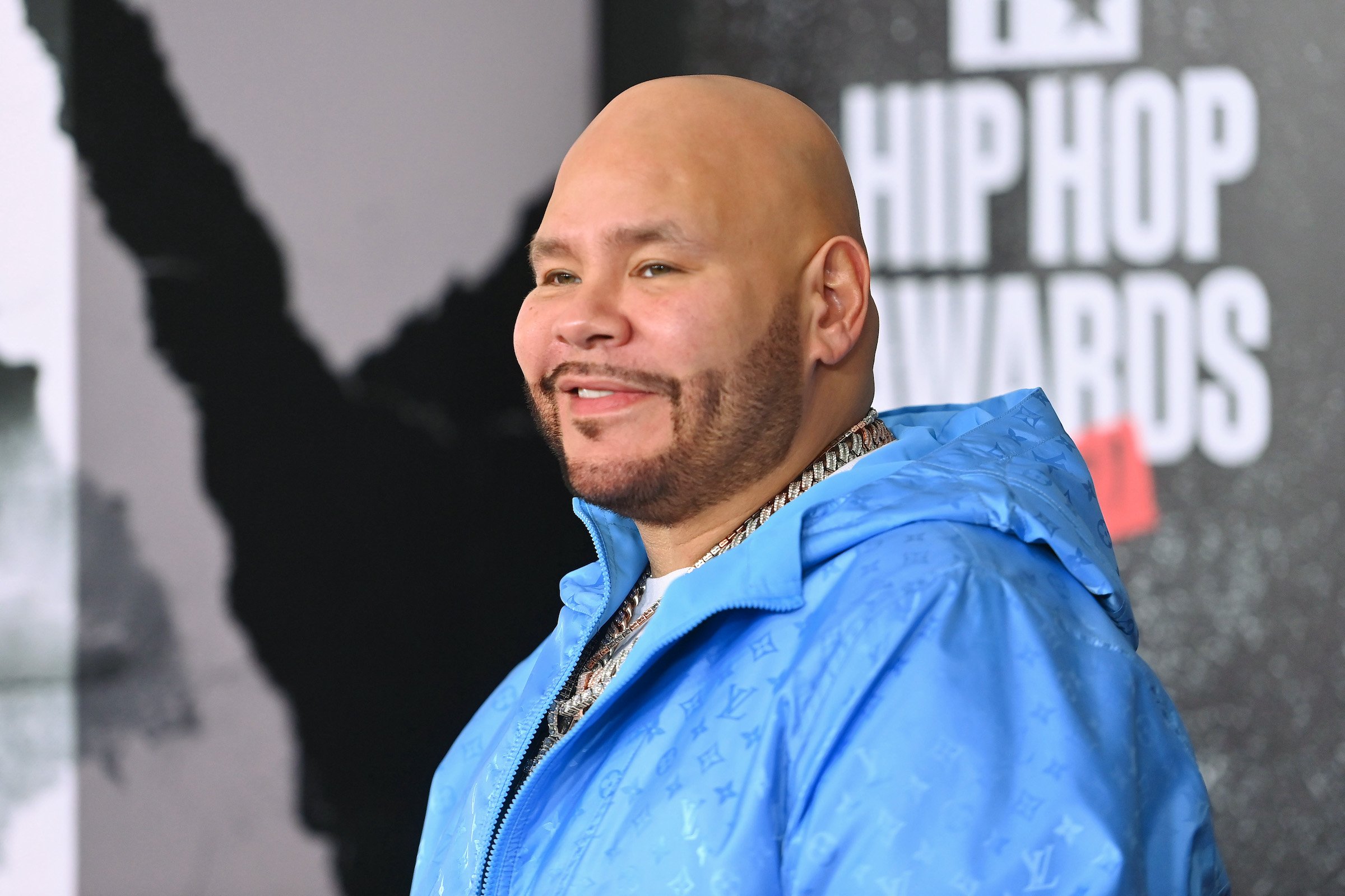 Fat Joe, who is getting a new TV show on Starz, wearing a blue jacket