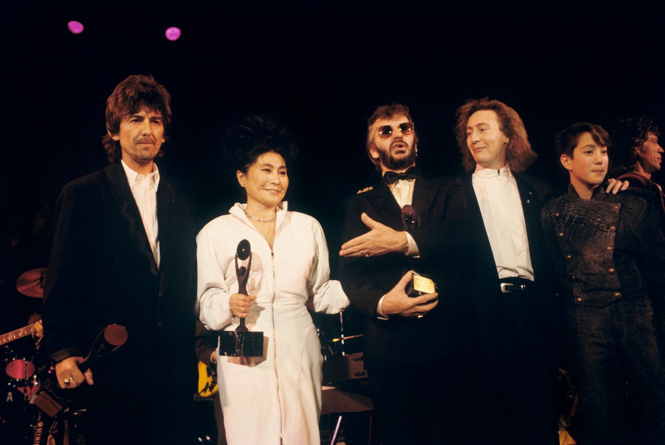 George Harrison, Yoko Ono, Ringo Starr, and Julian Lennon at The Beatles' Rock & Roll Hall of Fame induction in 1988.