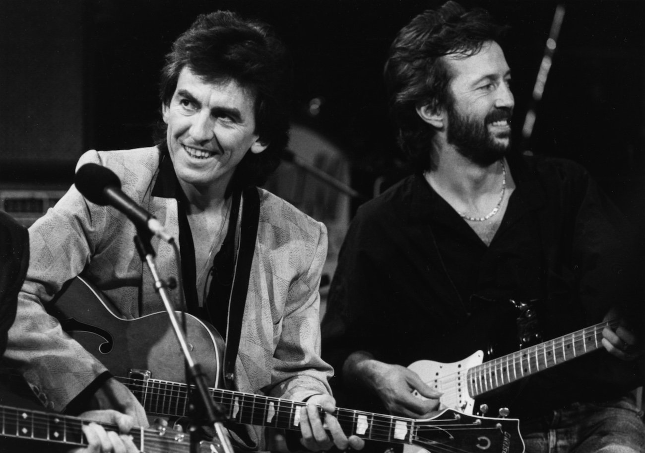 George Harrison and Eric Clapton performing during a tribute concert for Carl Perkins in 1985.