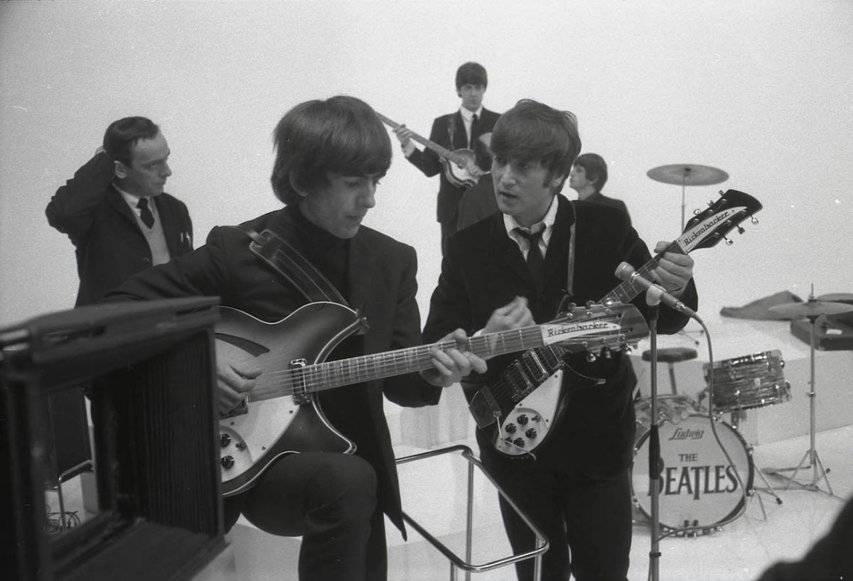 George Harrison and John Lennon on the set of 'A Hard Day's Night' in 1964.