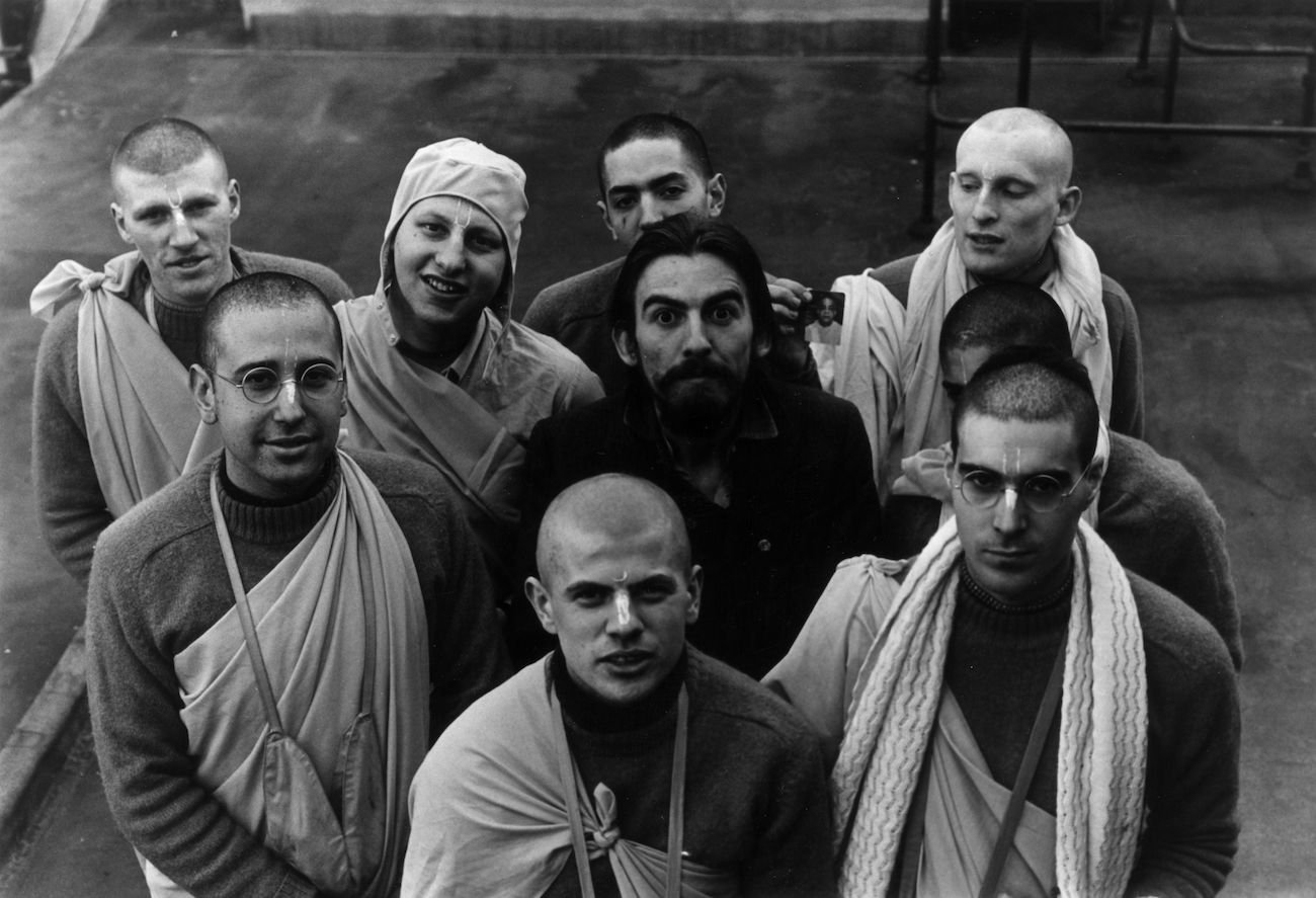 George Harrison being funny with members of the Hare Krishna Temple in 1970.