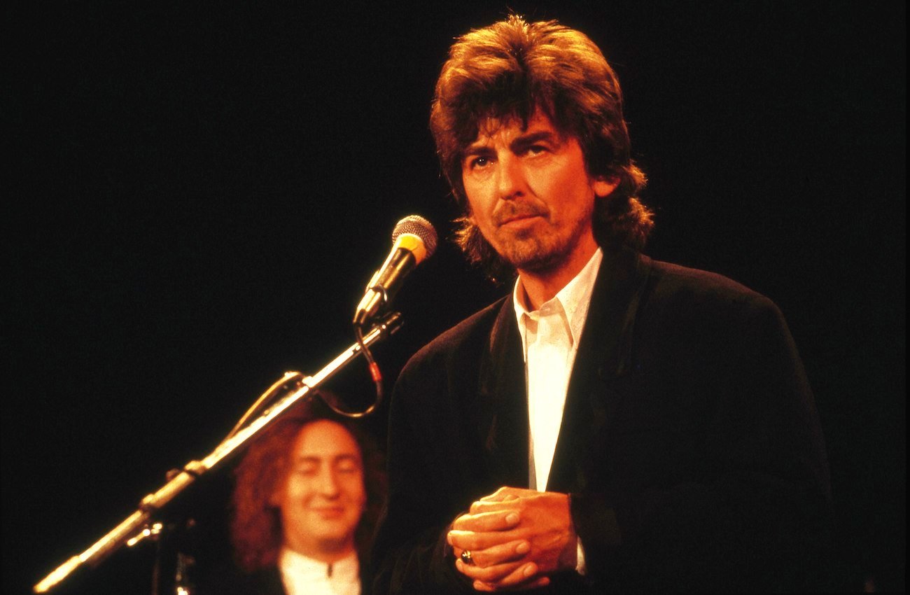 George Harrison speaking during The Beatles' Rock & Roll Hall of Fame induction in 1988.