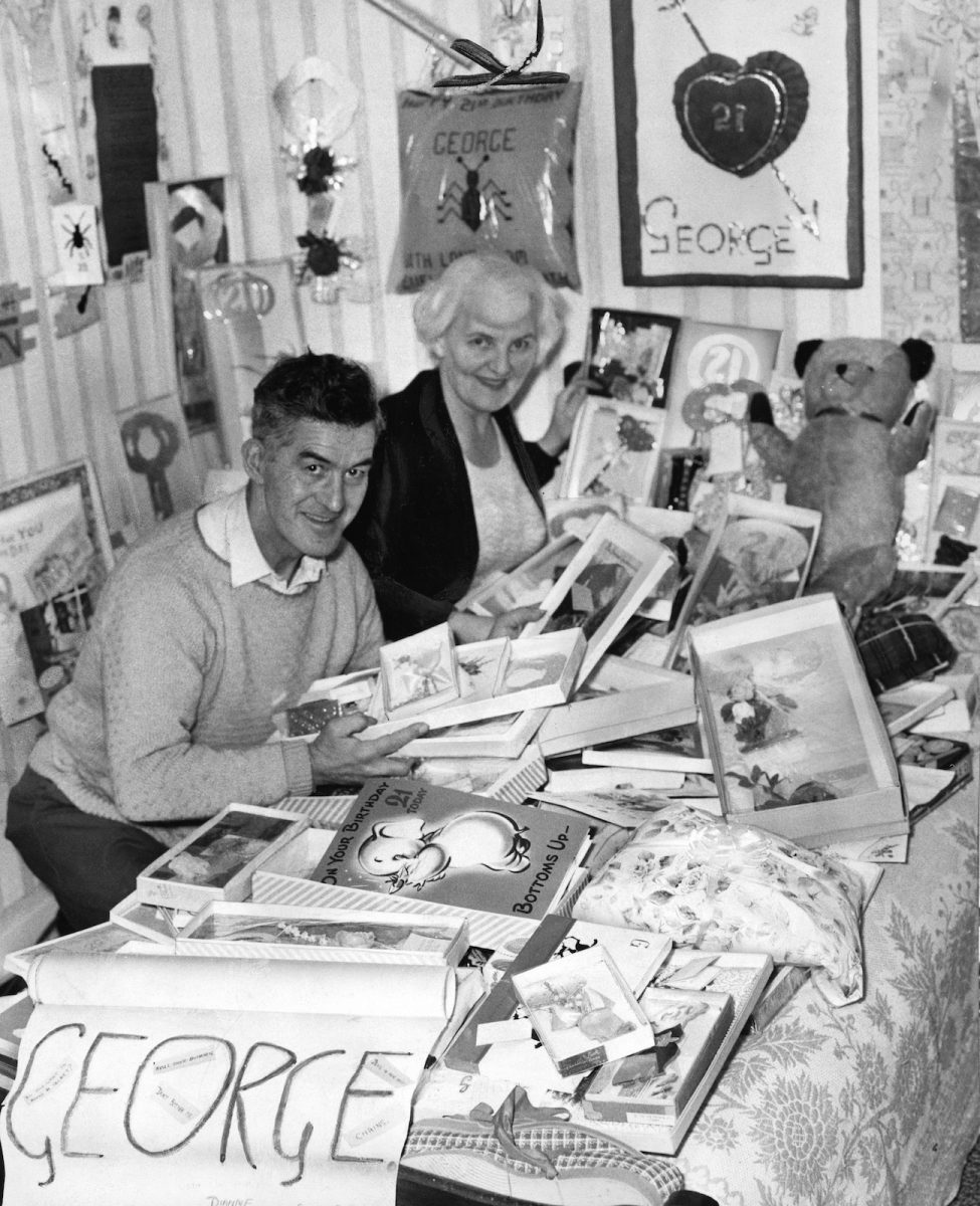 George Harrison's parents, Louise and Harold, sorting through fan mail for their son's 21st birthday in 1964.