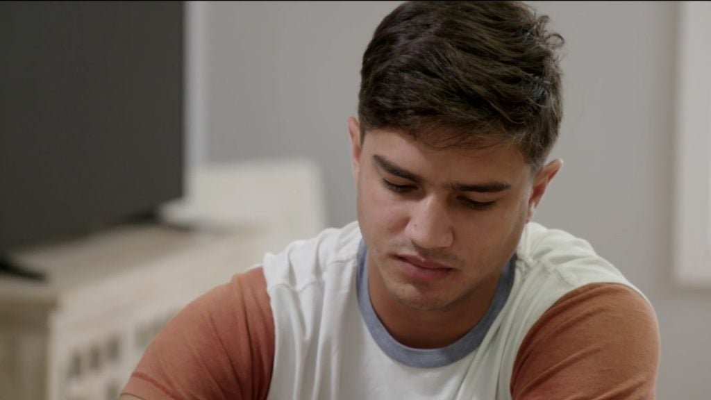 Guillermo staring at the table in his home with Kara in Virginia on '90 Day Fiancé'.