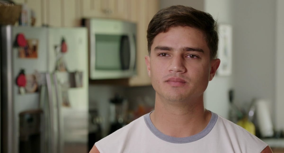 Guillermo stands in his kitchen in Virginia with Kara on '90 Day Fiancé'.
