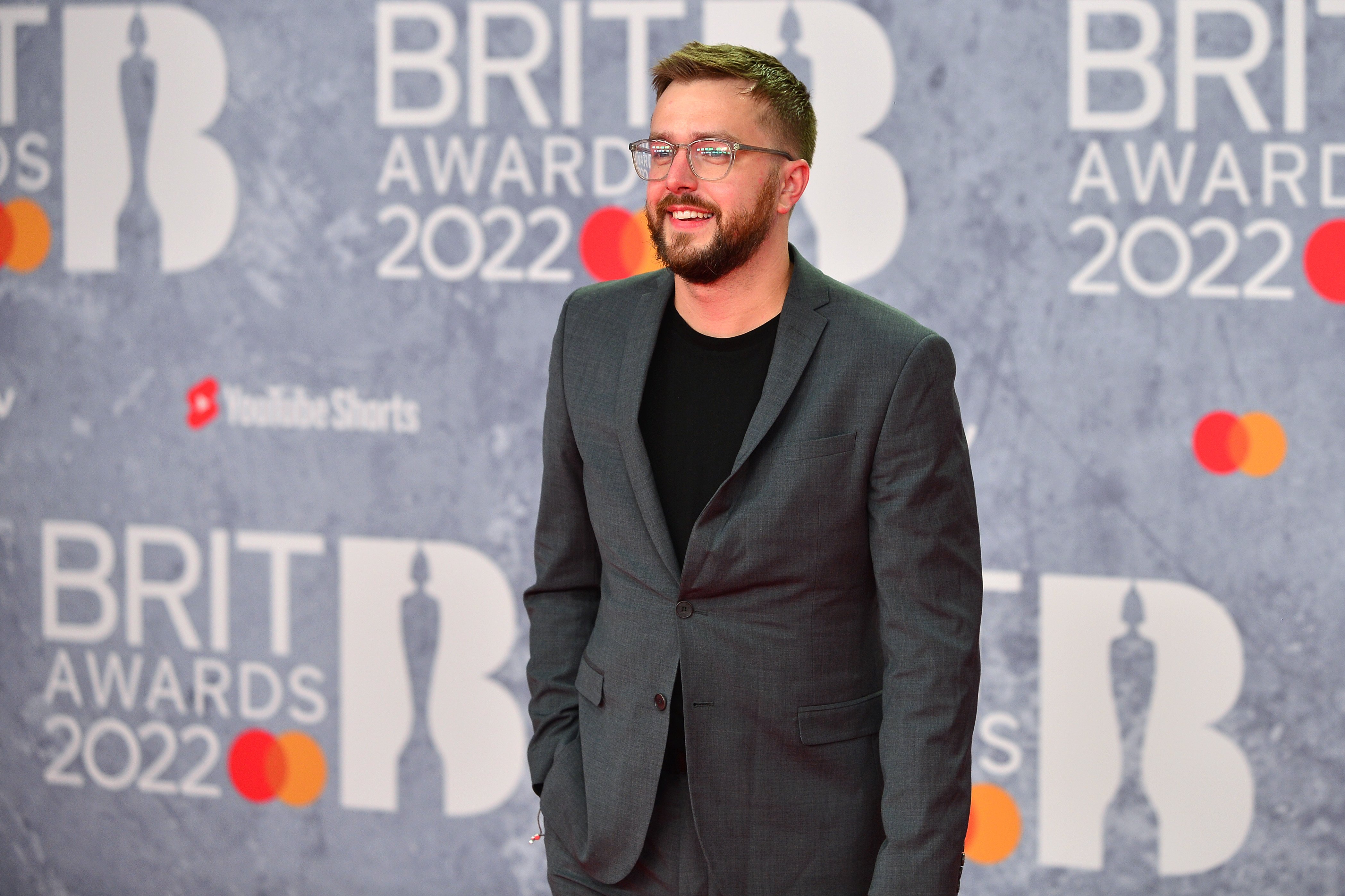 Iain Stirling smiling at the BRIT Awards 2022