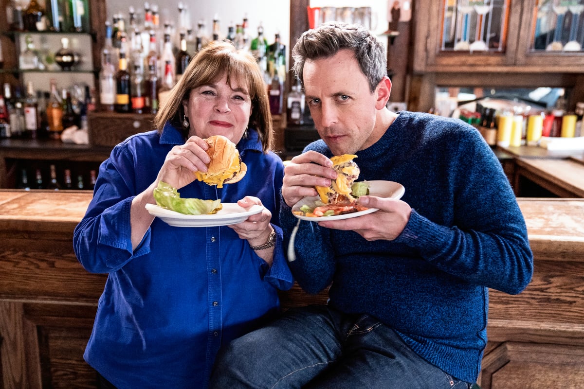 Ina Garten and host Seth Meyers devour cheeseburgers during "Seth Goes Day Drinking with Ina Garten" on February 6, 2019